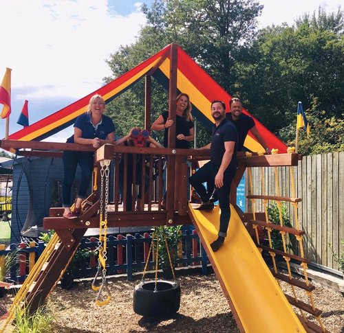 Adults on climbing frame