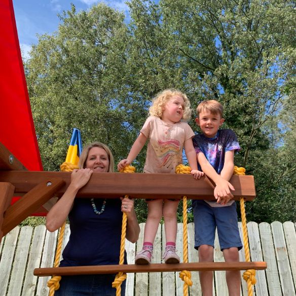 Adult using a climbing frame